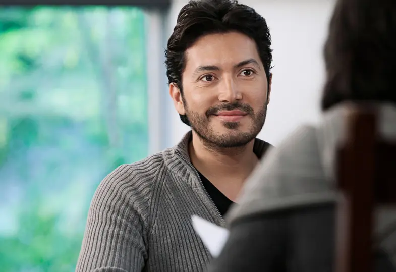 A financial customer with limited English proficiency speaks to an adviser